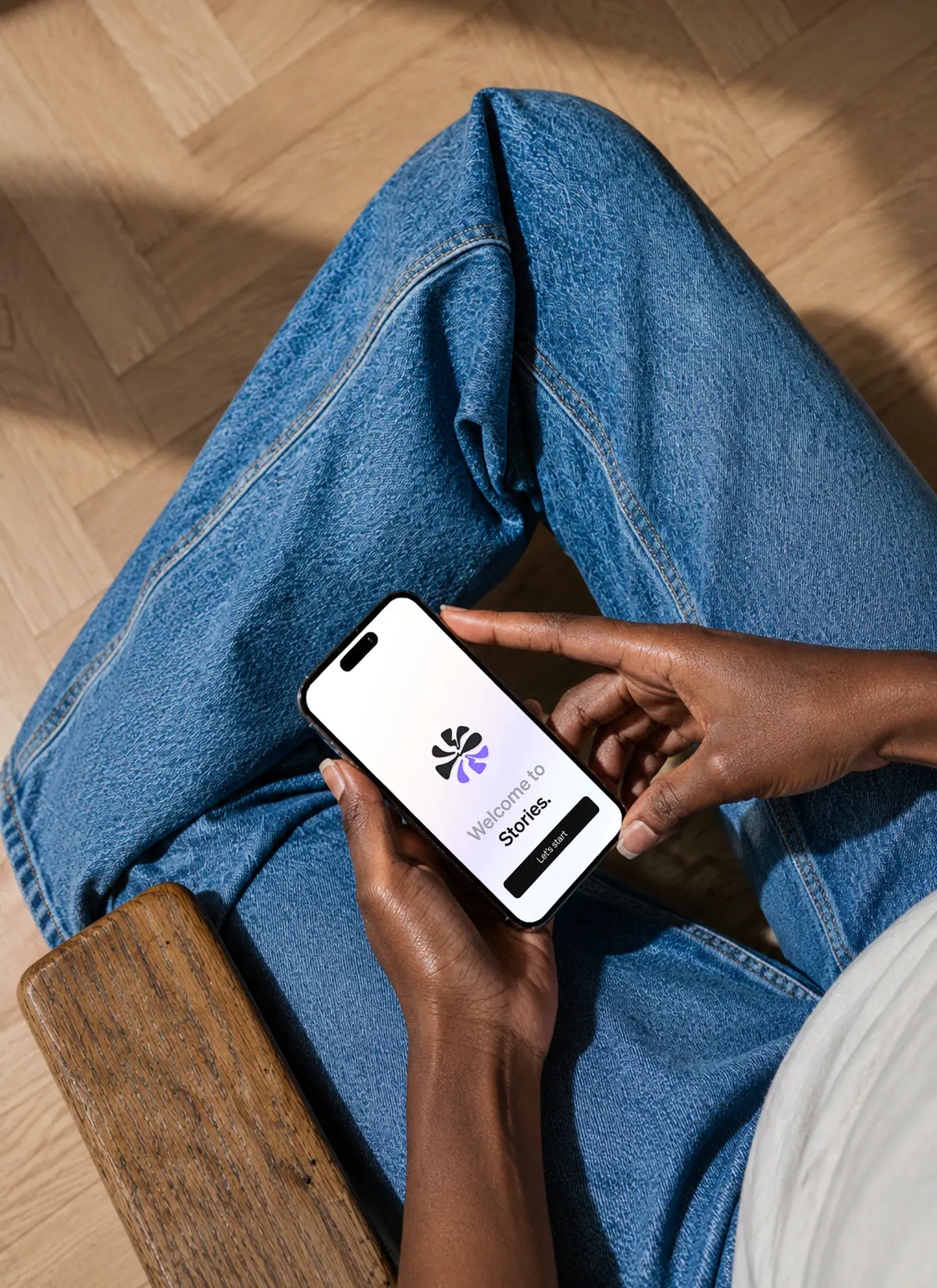 Stories mobile welcome screen shown on a phone